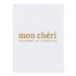 A large, white cotton tea towel featuring gold text and a logo.