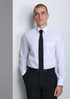 A classic fit long sleeve men's shirt in white, paired with a black tie and dark pants, featuring a chest pocket and branding.