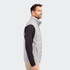 A grey men's hybrid vest with a high collar, featuring a zip front and side without sleeves.