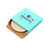 A round eco wireless charger in a beige hue, presented in a colourful branded box with various geometric shapes.