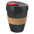A reusable coffee cup with a black body, cork band, and red lid. Features a logo.