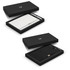 A black gift box containing a white notebook and a pen, both featuring a logo, presented elegantly.