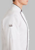 A white long sleeve chef jacket with a black trim, featuring a side pocket and a collarless design.