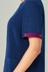 A navy blue scrub top with short sleeves featuring a maroon cuff detail and an attached logo.