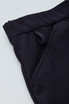 A close-up of a black women's comfort waist cargo skirt, highlighting the waistband and pocket details.