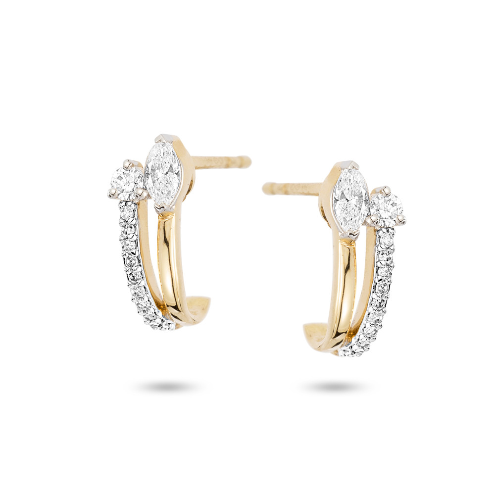 A modern interpretation of the classic huggie hoop. The Grace Marquise + Round J Hoop Earrings offer two diamonds and hand set pave diamonds down the side all set in 14k yellow gold. 