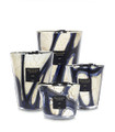The hand-blown glass of the Stones Lazuli scented candle has a marbled pattern perfectly accented with vibrant blues. 

