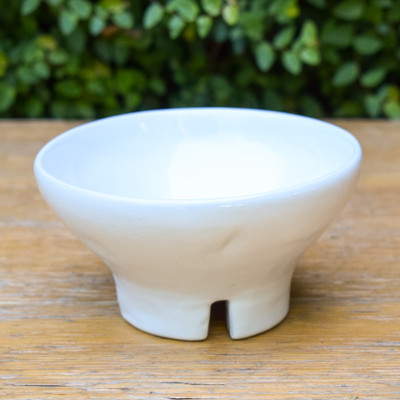 Elevate your bowl game - literally! This classic white ceramic bowl is handmade in Peru and is perfect to serve your favorite dip or store your fruits.

