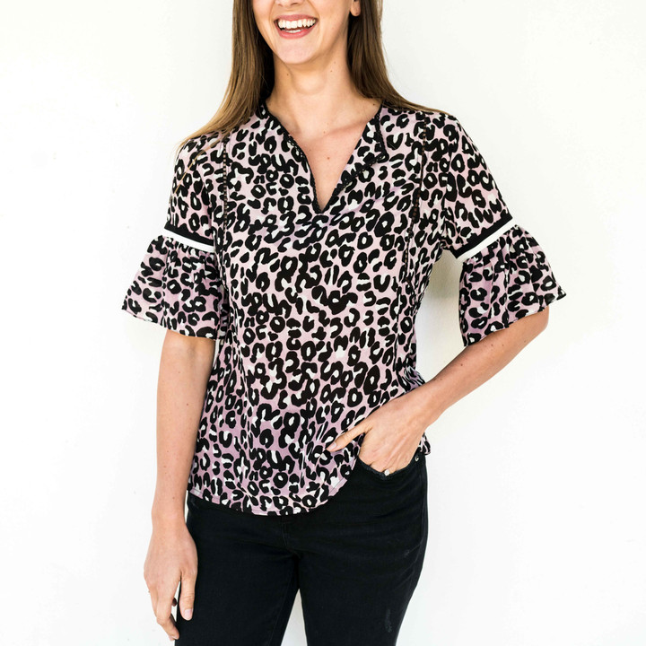 Every well-edited suitcase needs one of these blouses packed in it! We love the airy sleeves with contrast trim and the easy silhouette. Wear yours with jeans and a slide.

