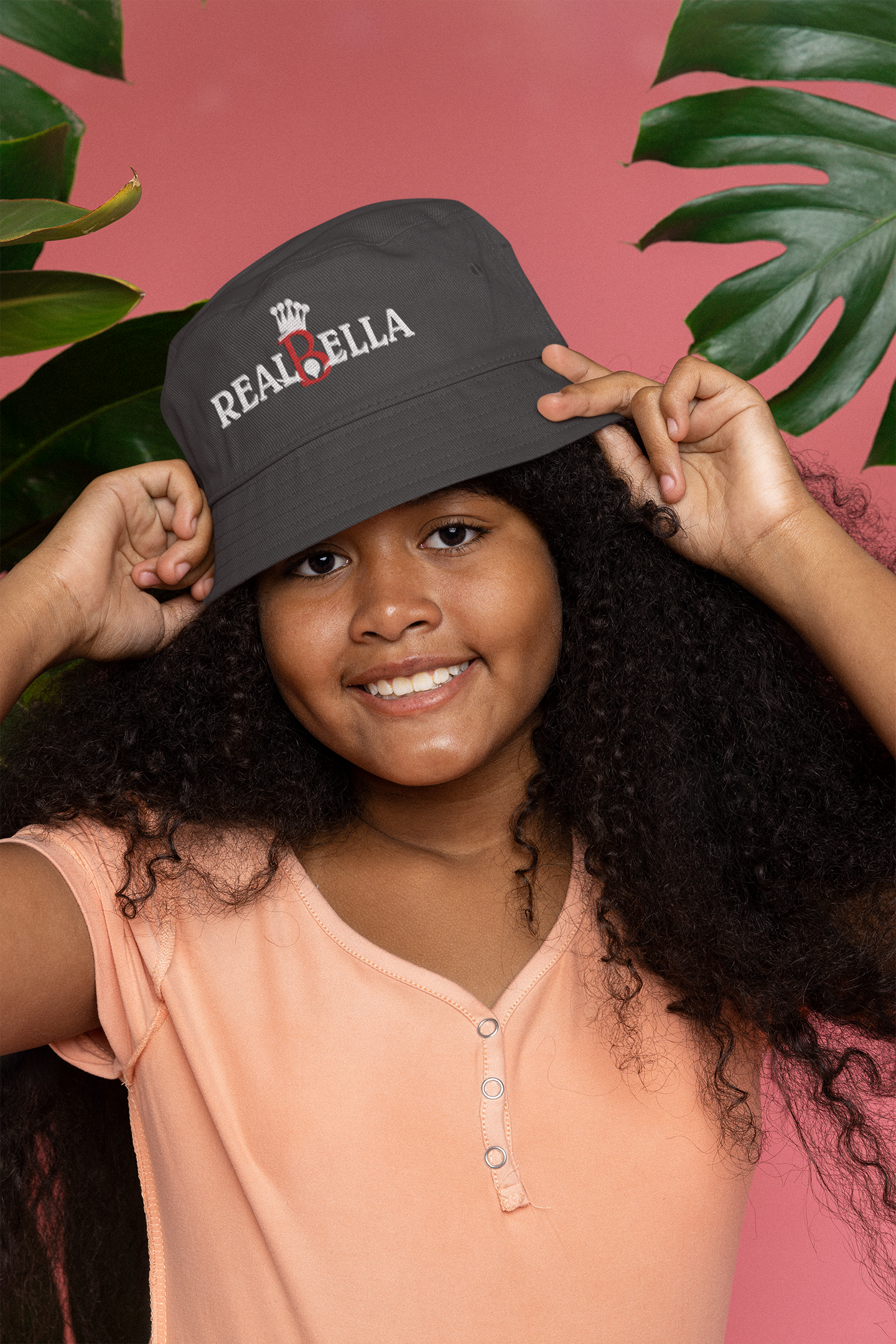 mockup-of-a-happy-curly-haired-girl-wearing-a-bucket-hat-at-a-studio-m25612-2.png