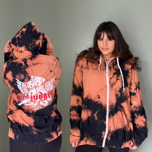 A woman wearing a graphic hoodie from our shop