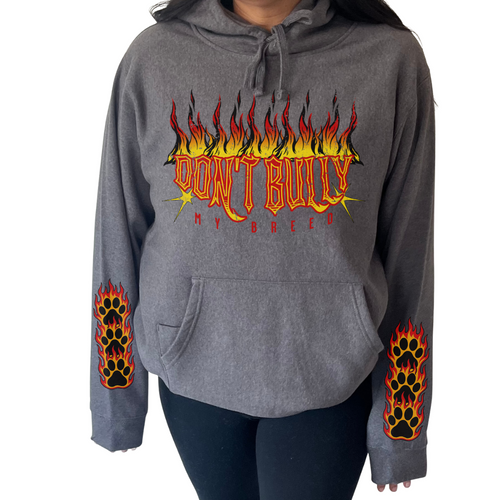 A woman wearing a graphic hoodie from our shop