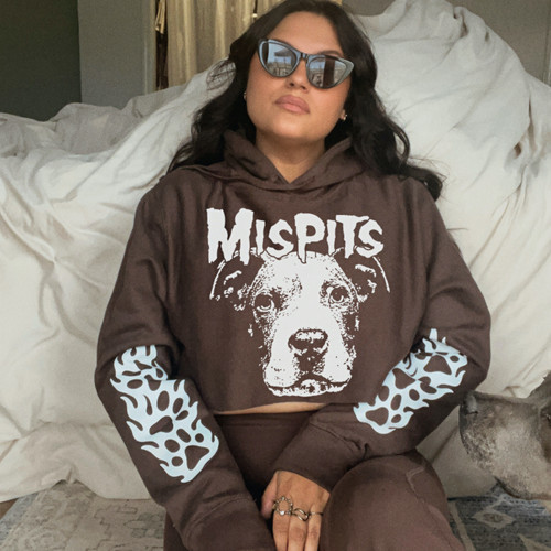 A woman wearing a graphic hoodie from our shop