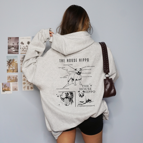 A woman wearing a HOUSE HIPPO hoodie from our shop