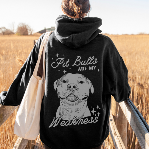 A woman wearing a graphic sweater from our shop 