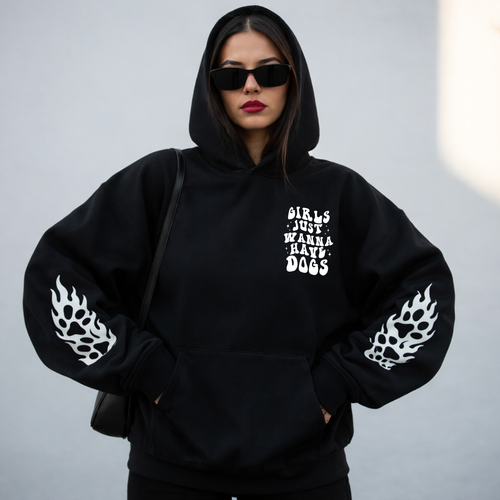 A woman wearing a graphic sweater from our shop 