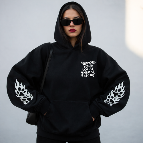 A woman wearing a graphic sweater from our shop 