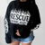 Woman wearing a RESCUE ADOPT FOSTER graphic hoodie from our shop