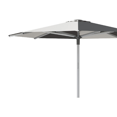 Close up side view of a patio umbrella with contrasting panels
