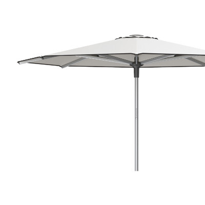 Close up side view of a patio umbrella with a contrasting top vent and bottom binding