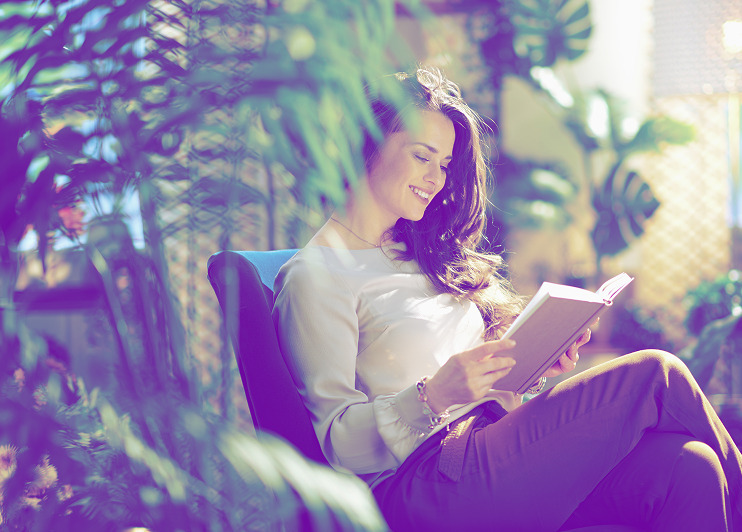 A woman who read a book near plants