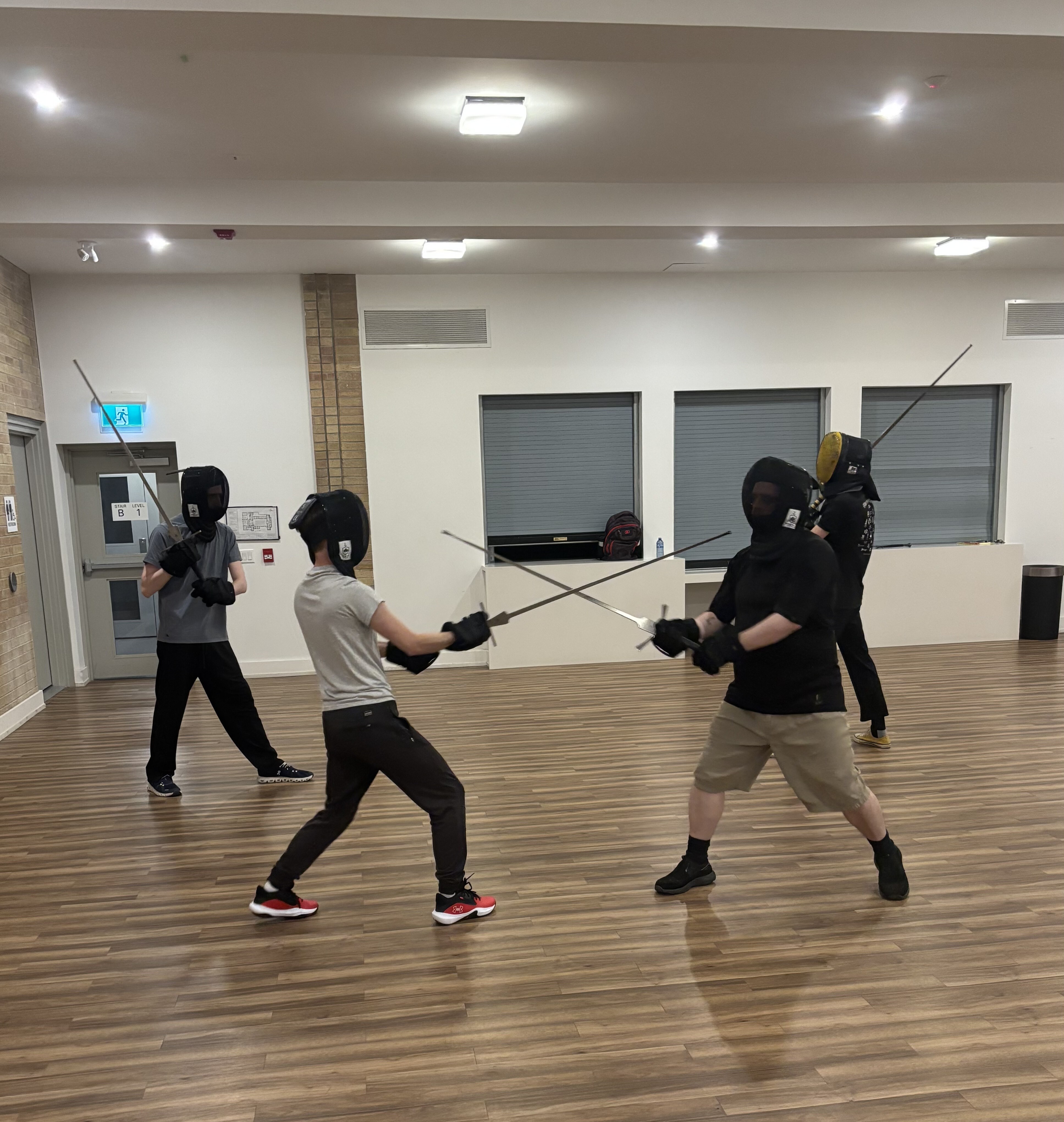 Students training German longsword at a HEMA class in Toronto