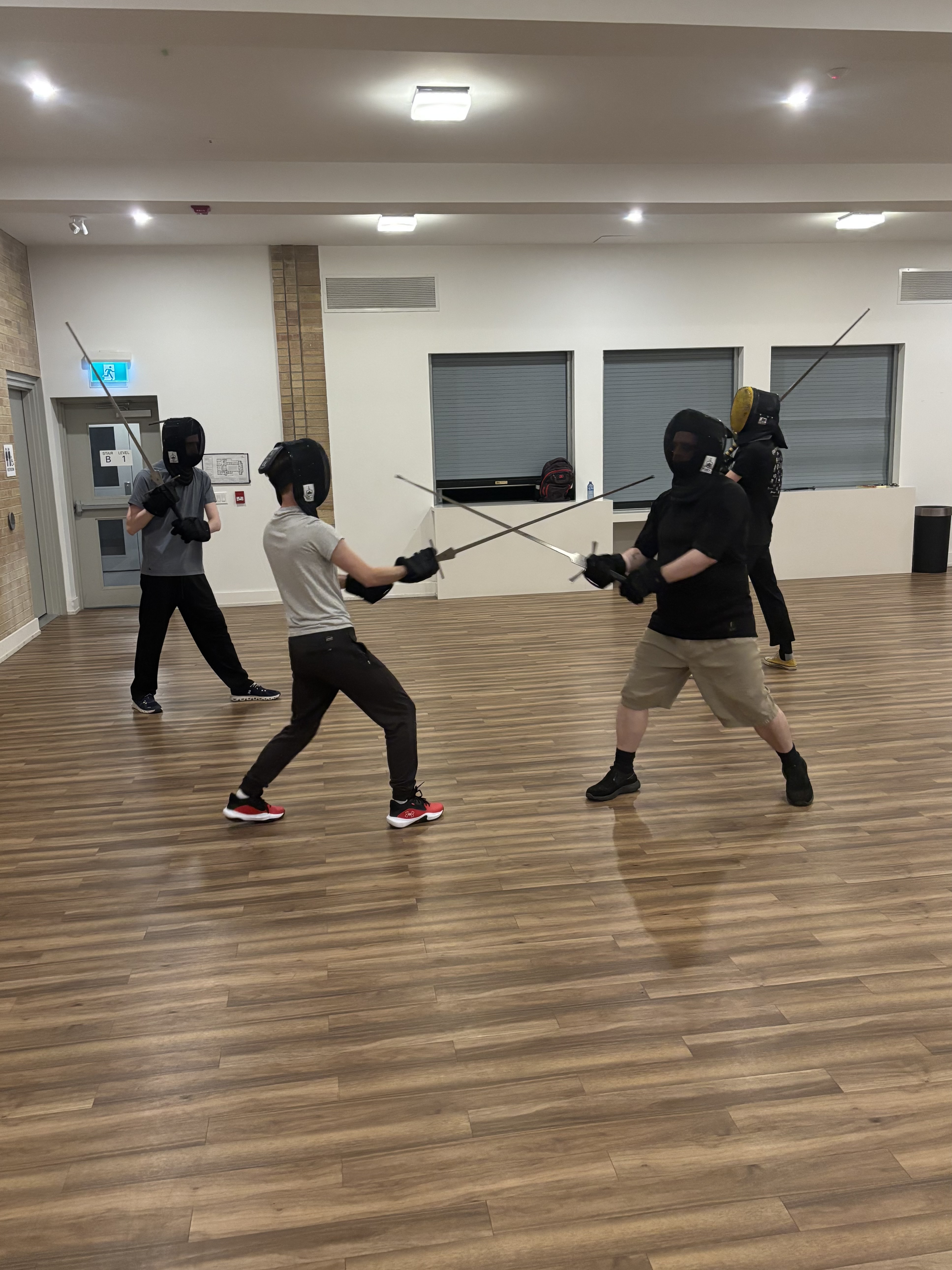 Students training German longsword at a HEMA class in Toronto