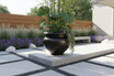 24" Arzu Brass Urn Planter in modern garden design