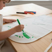 Child painting their apron