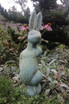 Silly Bunny statue in copper rust finish frong