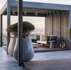 Multiple Ash Fiberstone Planters on patio