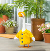 Porch Goose dressed in yellow raincoat
