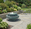 Nirvana 30" Cast Stone Cascading Fountain in garden