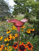 Blown Glass Butterfly Feeder Magenta in flower garden