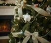 Sheep ornament with glitter on decorated Christmas tree