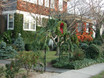 Gothic Garden Archway decorated for Christmas with evergreen swags and wreath