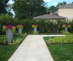 Geo Tapered Square Fiberglass Planters lining a walkway
