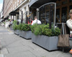 Geo Trough planters used to create private seating at restaurant