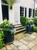 Fiberglass Trafalger Round Planters flanking doorway