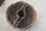 18" Lamppost coco liner in basket with soil added