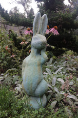 Silly Bunny statue in copper rust finish frong