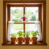 Mama Mouse Felt Ornament hanging in kitchen window
