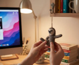 Yoga Sloth Ornament with person bending into shape