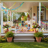 Yellow Paper Pinwheels decorating front porch for party