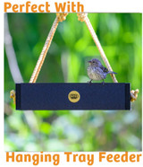 Seed cake in use with hanging tray platform feeder