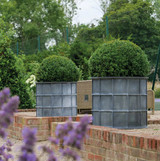 Round Sienna Steel Planter coated in zinc