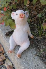 Front view of Day Dreaming Piglet Statue