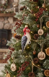Red headed woodpecker with black wings ornament