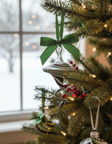 Flat Top Swirly Glass Ornament in Christmas colors red and green on tree