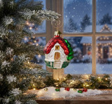 Cottage with Red Roof Blown Glass Ornament on tree